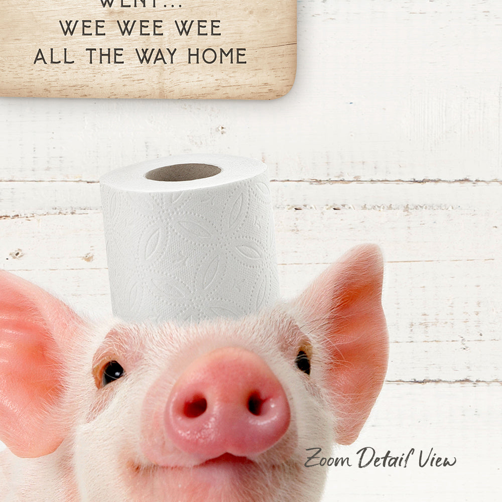 A pig with a roll of toilet paper on its head, with the text "Went... Wee Wee Wee All the Way Home" above it.