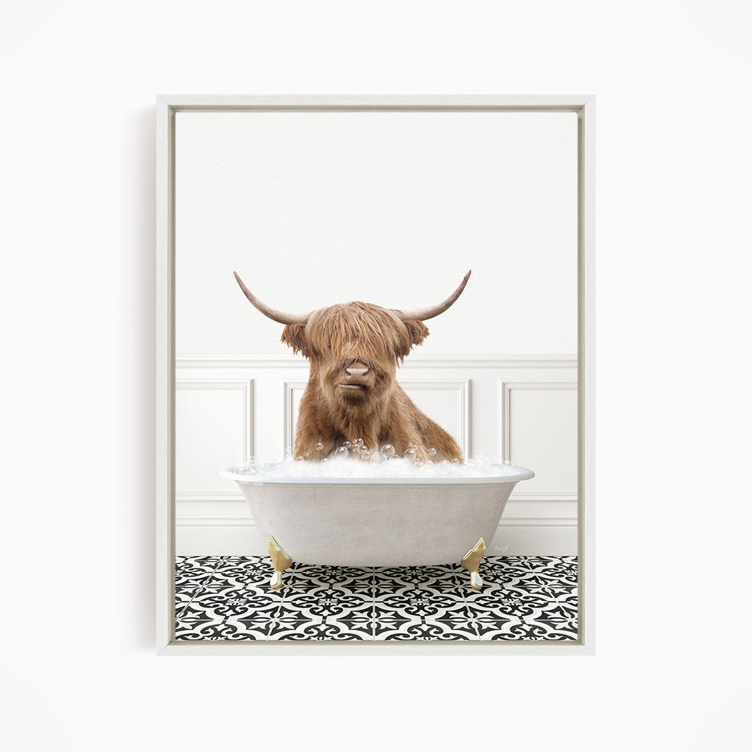 A brown cow with long horns is sitting in a white bathtub filled with water, creating a whimsical and amusing scene.