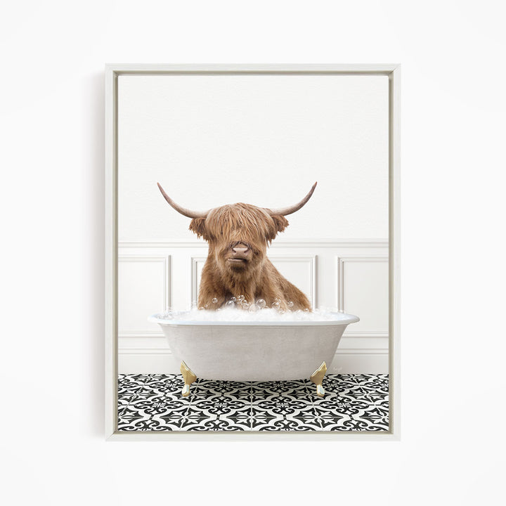 A brown cow with long horns is sitting in a white bathtub filled with water, creating a whimsical and amusing scene.