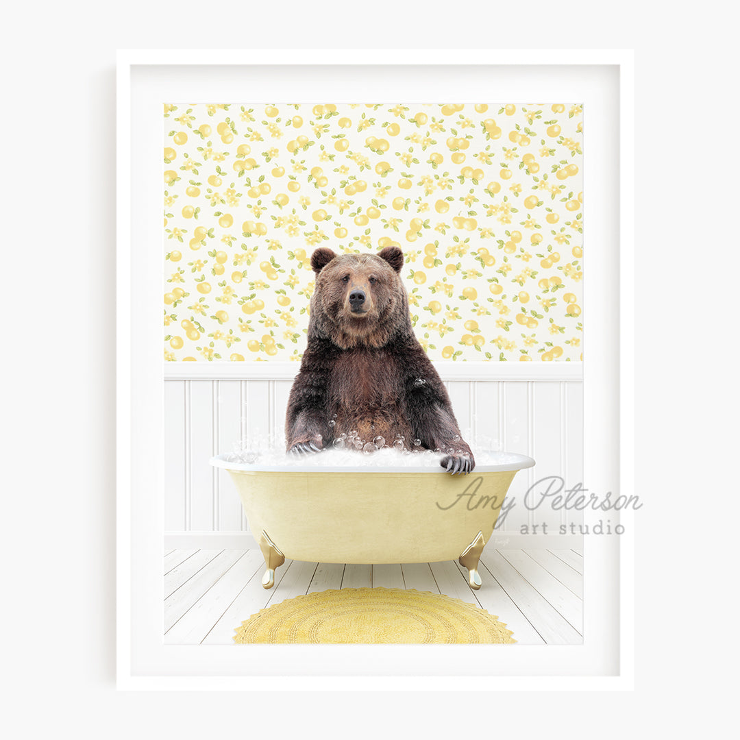 a brown bear sitting in a bath tub