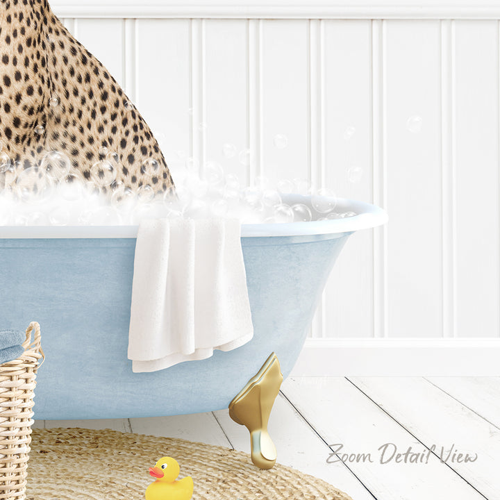 A leopard print towel is hanging on the side of a blue bathtub filled with water, with a rubber duck sitting in the tub.