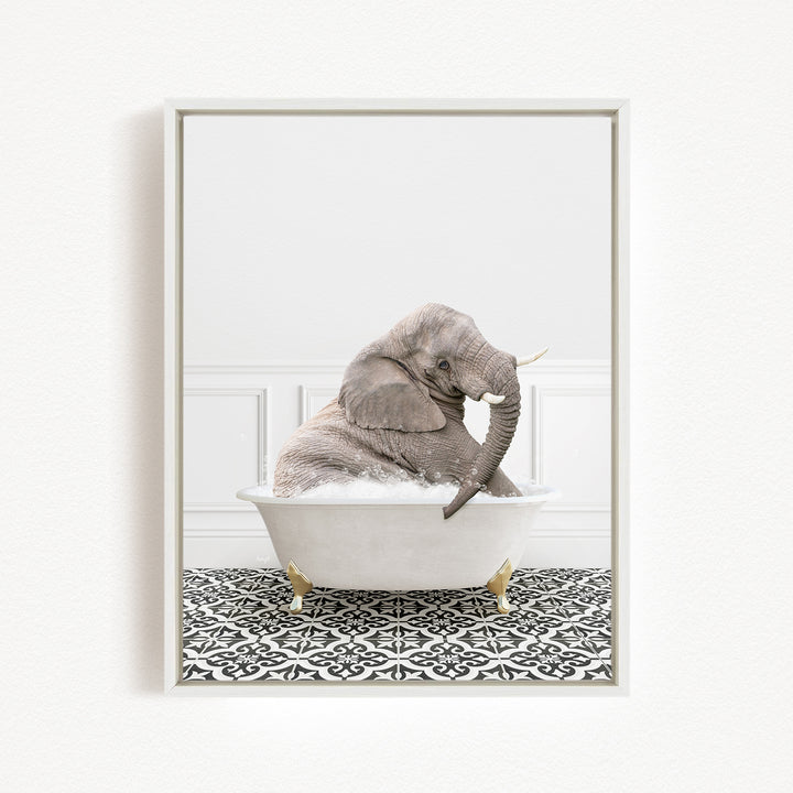 A gray elephant sitting in a white bathtub filled with water, surrounded by a black and white patterned floor.