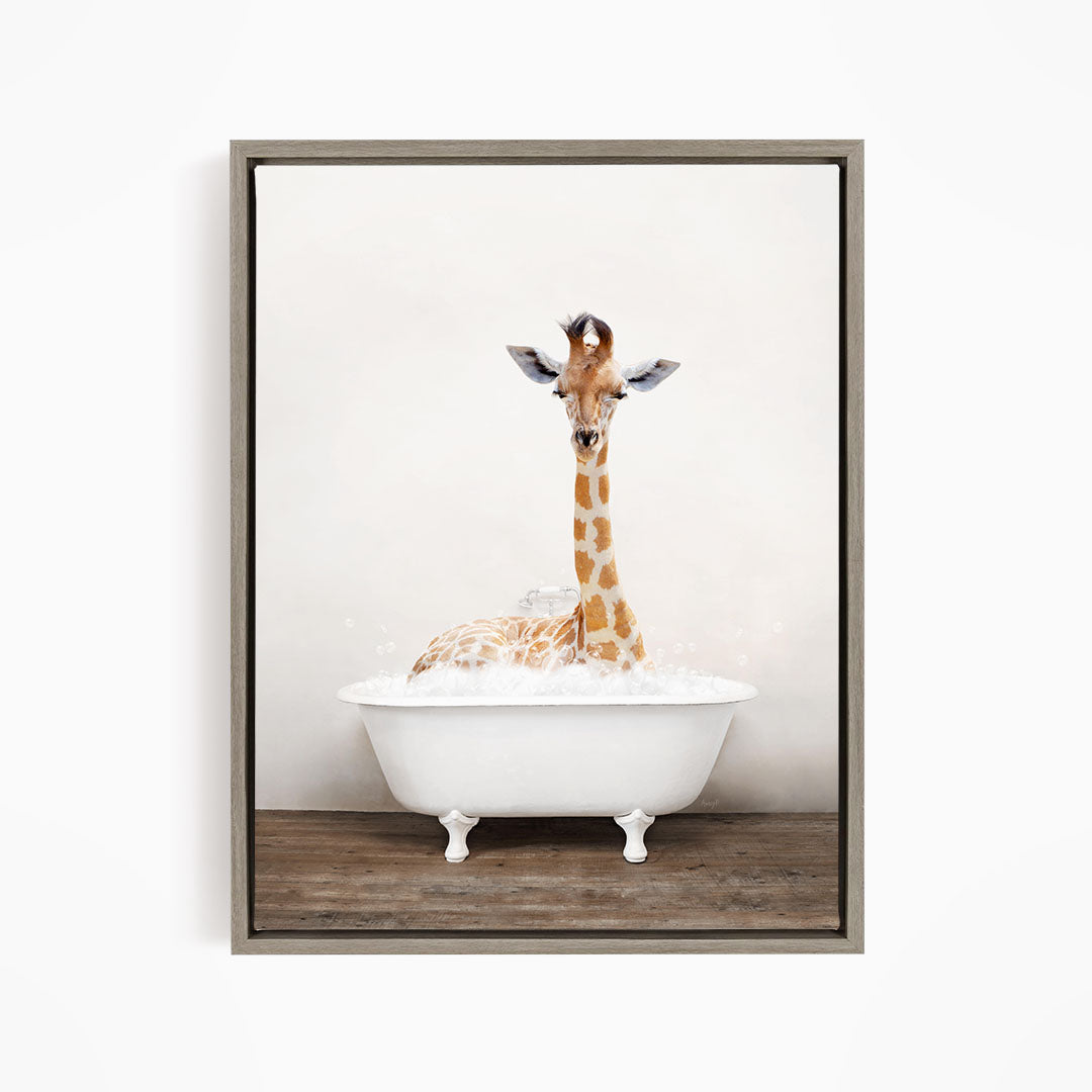 A giraffe sitting in a white bathtub filled with bubbles, creating a whimsical and playful scene.