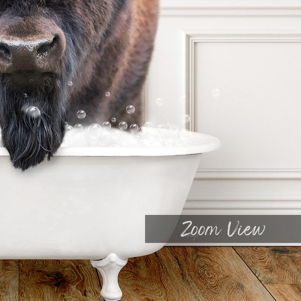 A close-up of a dog's face in a white bathtub filled with bubbles, with the word "Zoom View" written below the image.