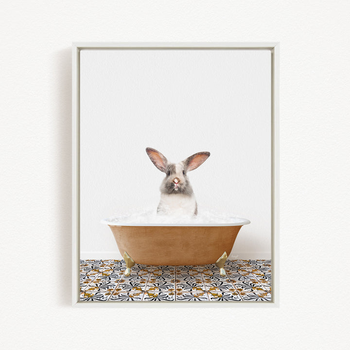 A white rabbit sitting in a bathtub filled with water, with a patterned tile floor beneath it.