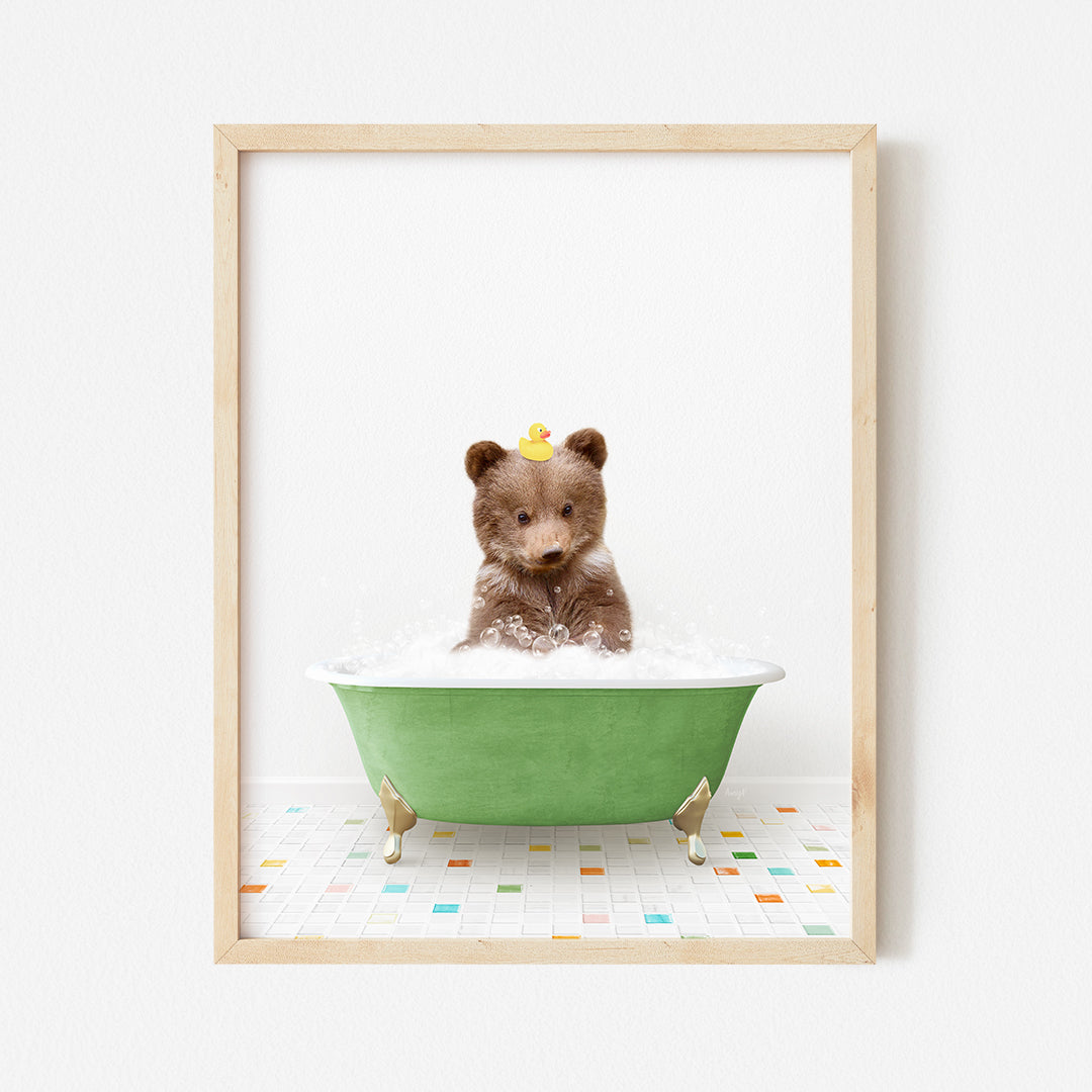 a teddy bear sitting in a green bath tub