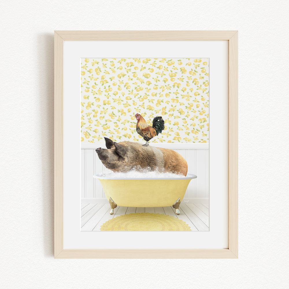 A framed image depicting a pig sitting in a yellow bathtub, with a rooster perched on its head, against a yellow and white floral wallpaper.