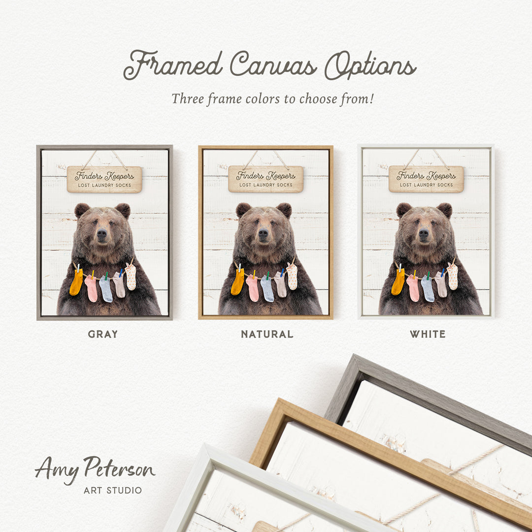 The image is a framed canvas option featuring three different color options for a framed canvas depicting a bear with laundry.