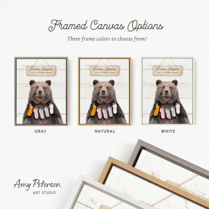 The image is a framed canvas option featuring three different color options for a framed canvas depicting a bear with laundry.