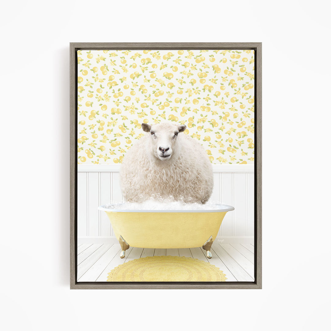 A fluffy white sheep sits in a yellow bathtub, surrounded by a yellow floral wallpaper.