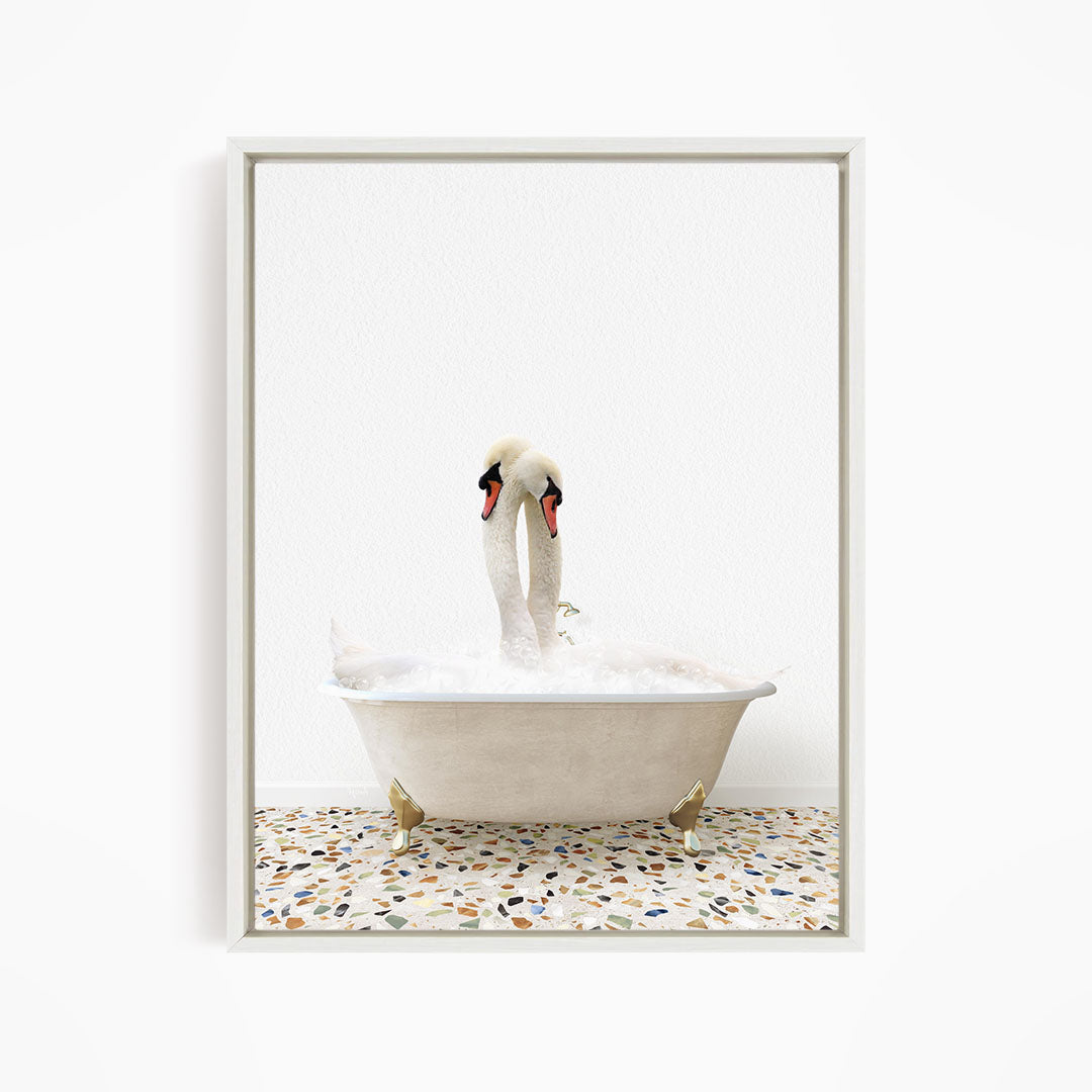 A pair of swans standing in a white bathtub filled with water, with a mosaic floor in the background.