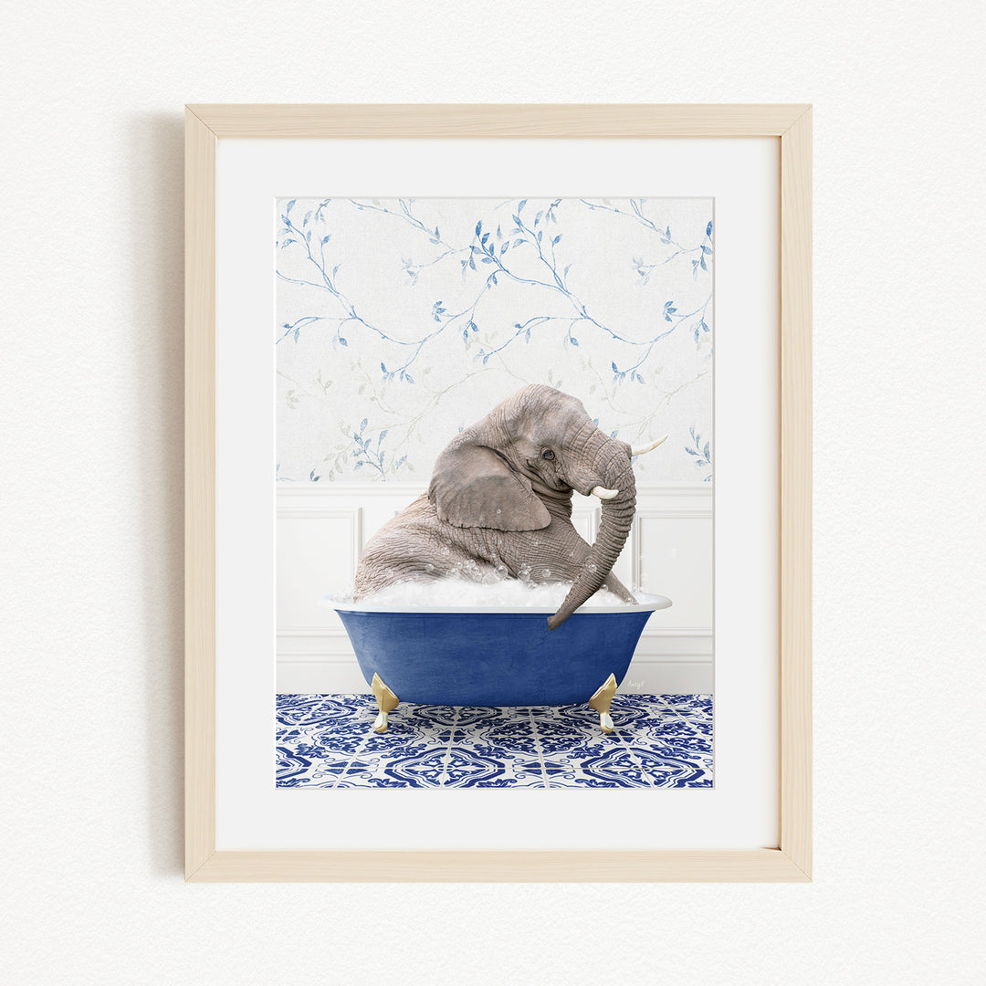 A gray elephant is sitting in a blue bathtub filled with water, surrounded by a blue and white patterned tile floor.