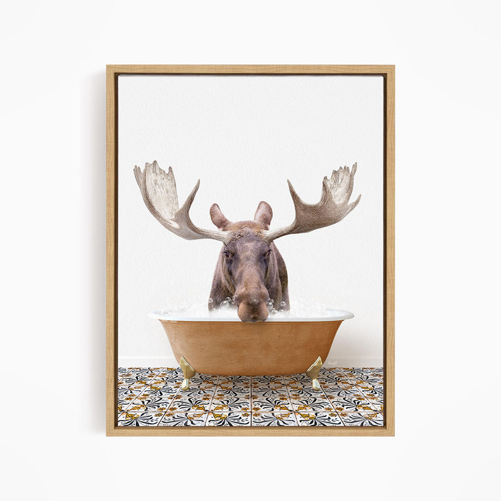 A moose with large antlers is sitting in a bathtub filled with water, creating a whimsical and playful scene.