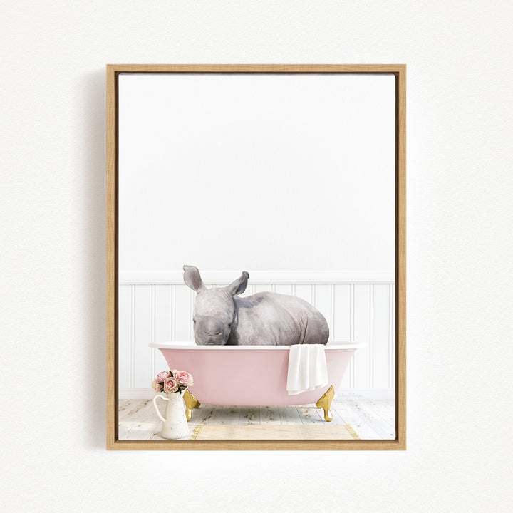 A rhinoceros is sitting in a pink bathtub, surrounded by flowers and a vase, creating a whimsical and charming scene.