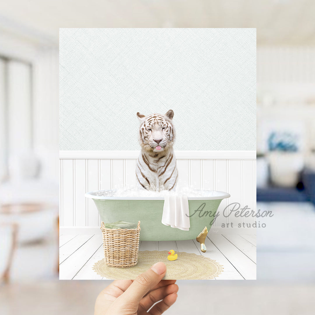 a person holding up a picture of a tiger in a bathtub