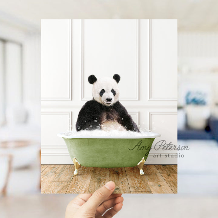 a panda bear sitting in a green bath tub