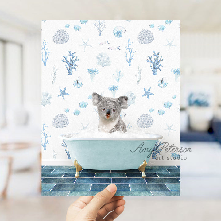 a hand holding a card with a picture of a koala in a bathtub