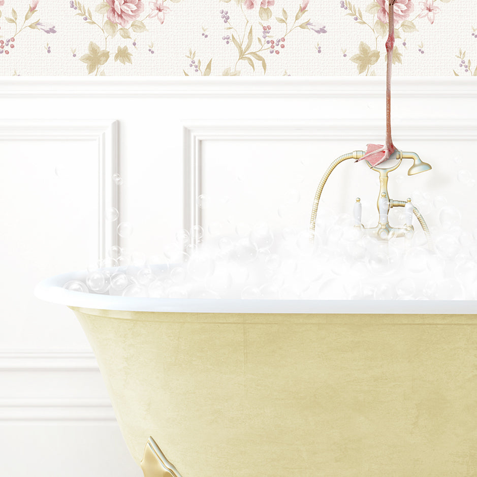 a bathtub filled with white foam and a pink umbrella