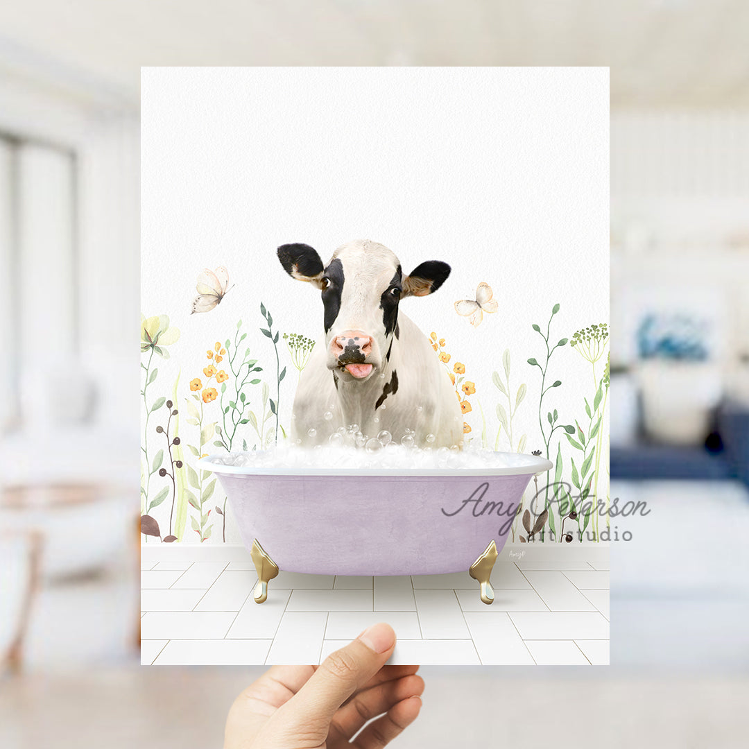 a person holding up a card with a picture of a cow in a bathtub