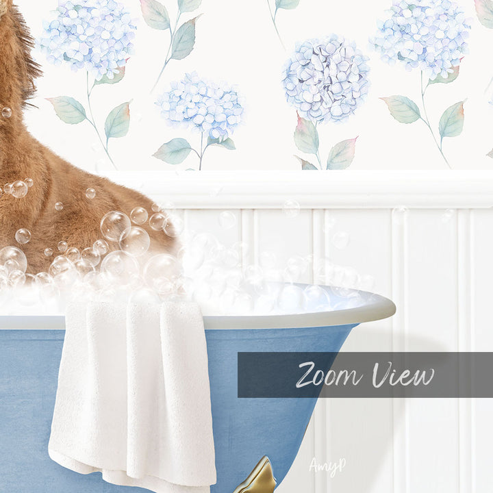 A dog is sitting in a blue bathtub filled with bubbles, with a towel hanging on the side and a floral wallpaper in the background.