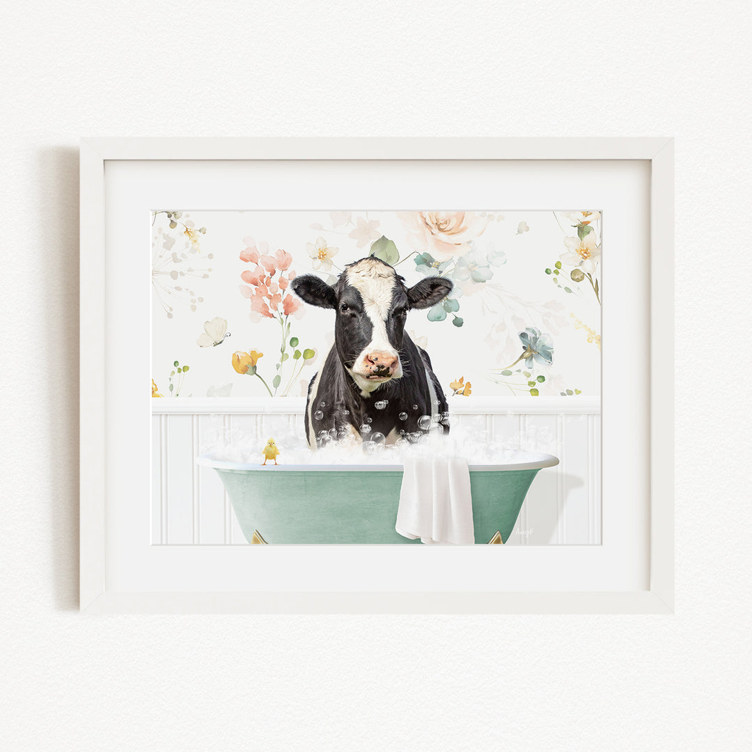 A black and white cow is sitting in a green bathtub filled with bubbles, surrounded by a floral background.