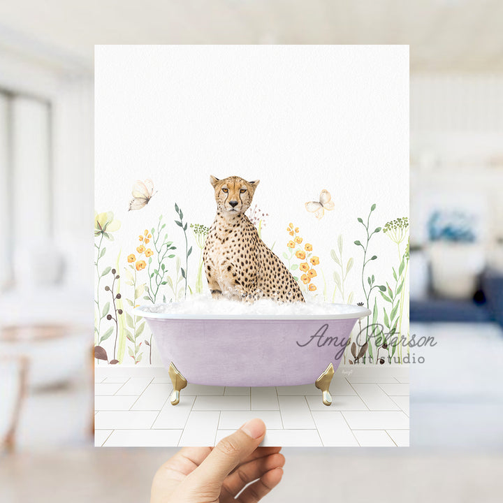 a hand holding a card with a picture of a cheetah in a bath