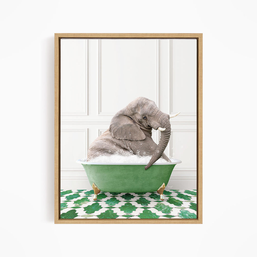 A gray elephant is sitting in a green bathtub filled with water, surrounded by a green and white patterned floor.