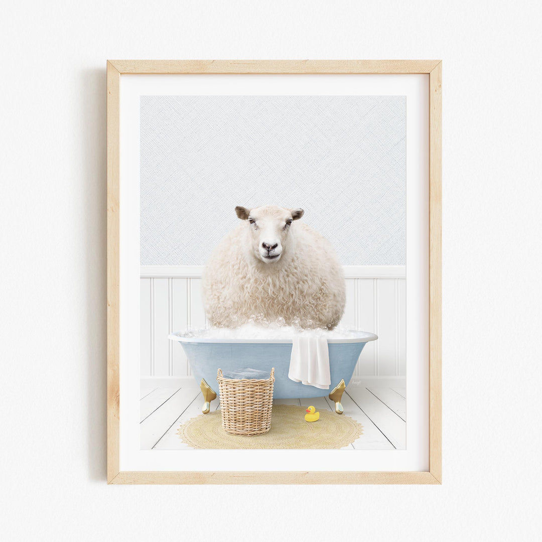 A fluffy white sheep sits in a blue bathtub filled with bubbles, surrounded by a yellow rubber duck and a wicker basket.