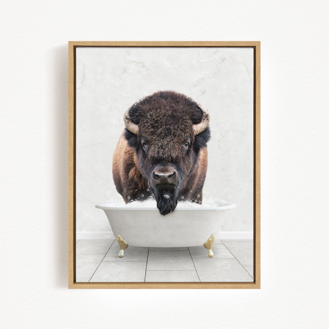 A buffalo with a long beard is sitting in a white bathtub, with its head above the water.