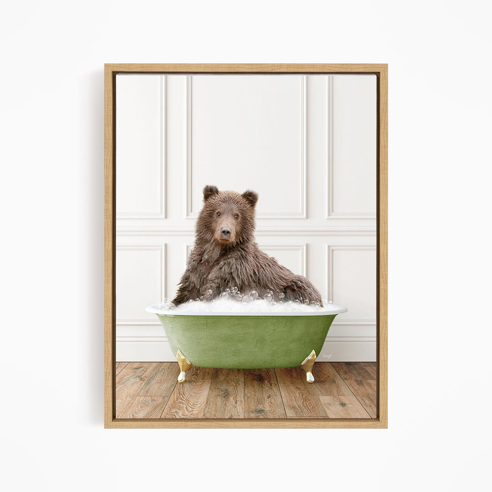 A brown bear sitting in a green bathtub filled with bubbles, looking directly at the camera.
