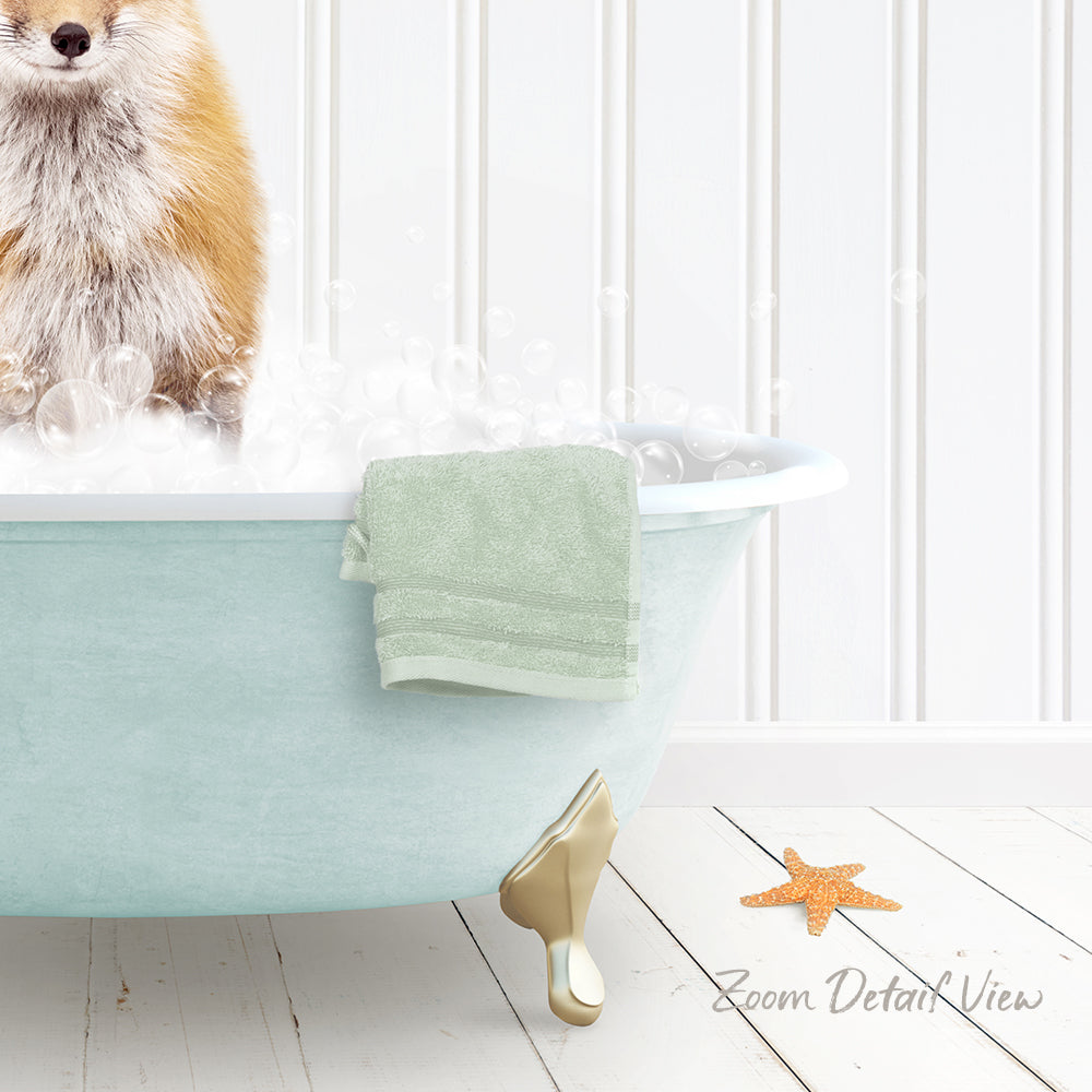 A dog is sitting in a bathtub filled with bubbles, with a towel and starfish nearby.