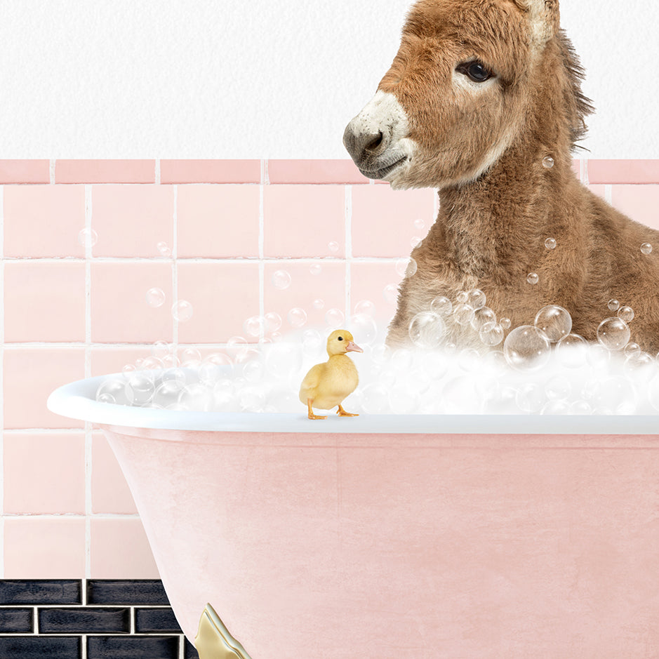 a donkey in a bathtub with bubbles and a rubber duck