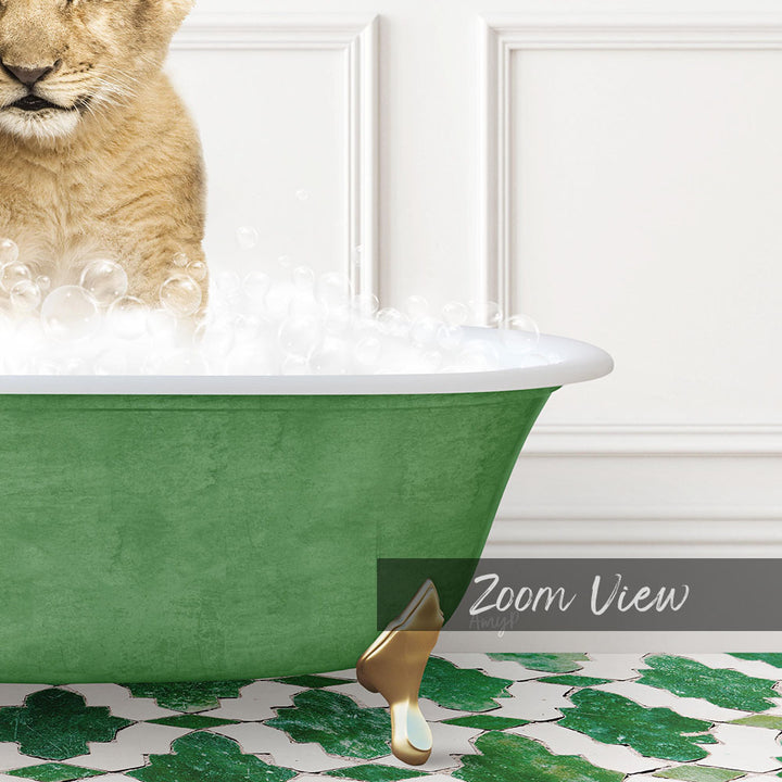 A cat is sitting in a green bathtub filled with bubbles, with a white wall and a patterned tile floor in the background.