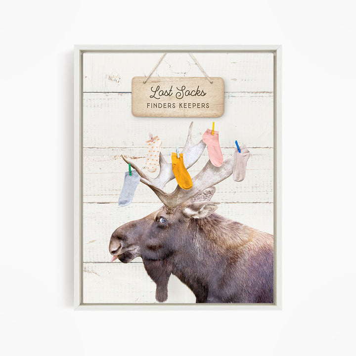 A moose with a sign that says "Lost Socks Finders Keepers" hanging above it.