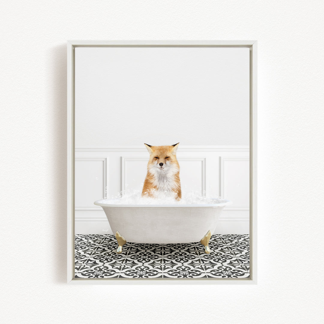 A fox is sitting in a white bathtub filled with bubbles, looking directly at the camera.