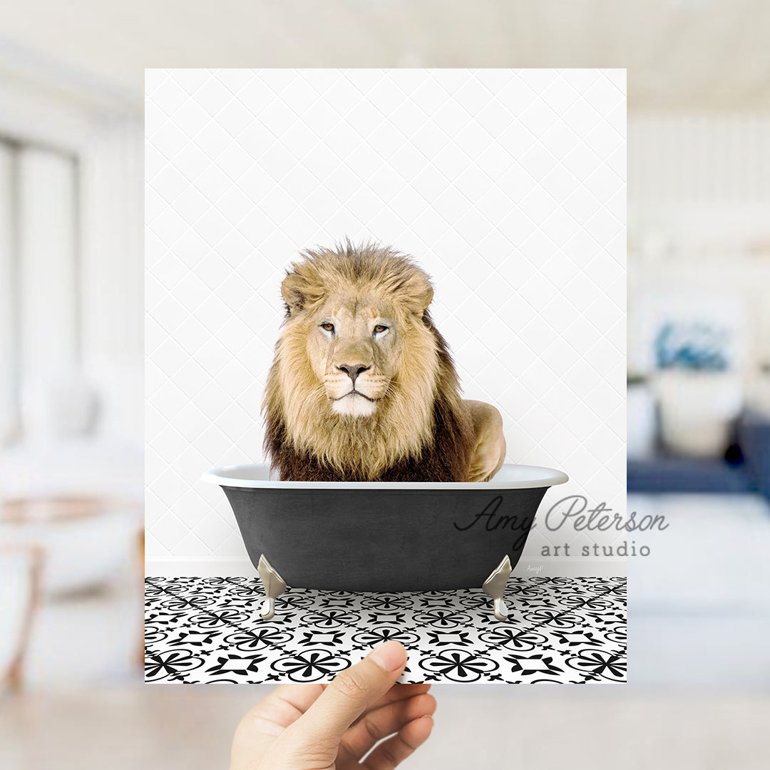 a hand holding a card with a lion in a bathtub