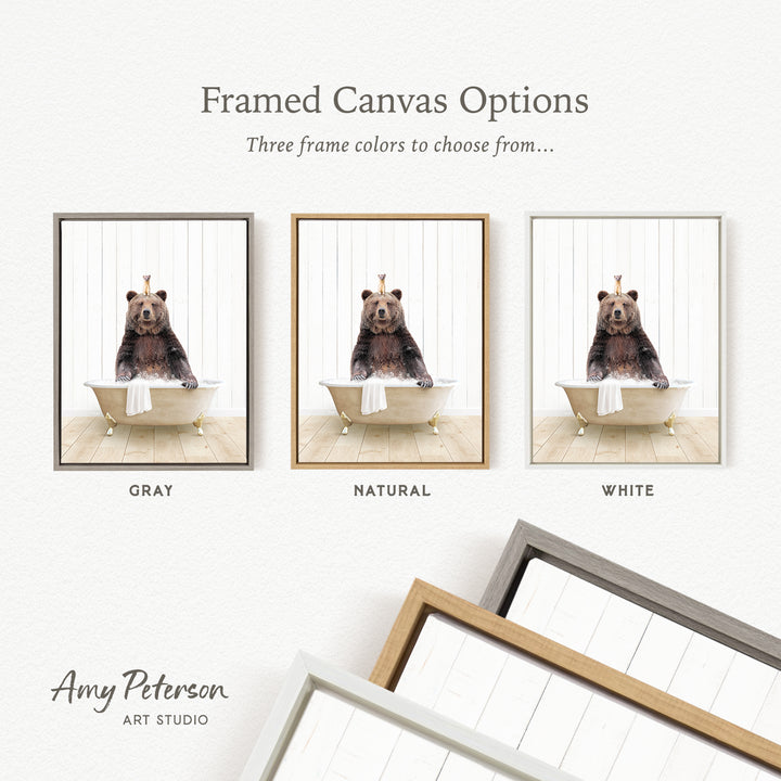 The image is a framed canvas option showcasing three different frame colors: gray, natural, and white. The canvas features a bear sitting in a bathtub, and the frame color options are displayed below the canvas.