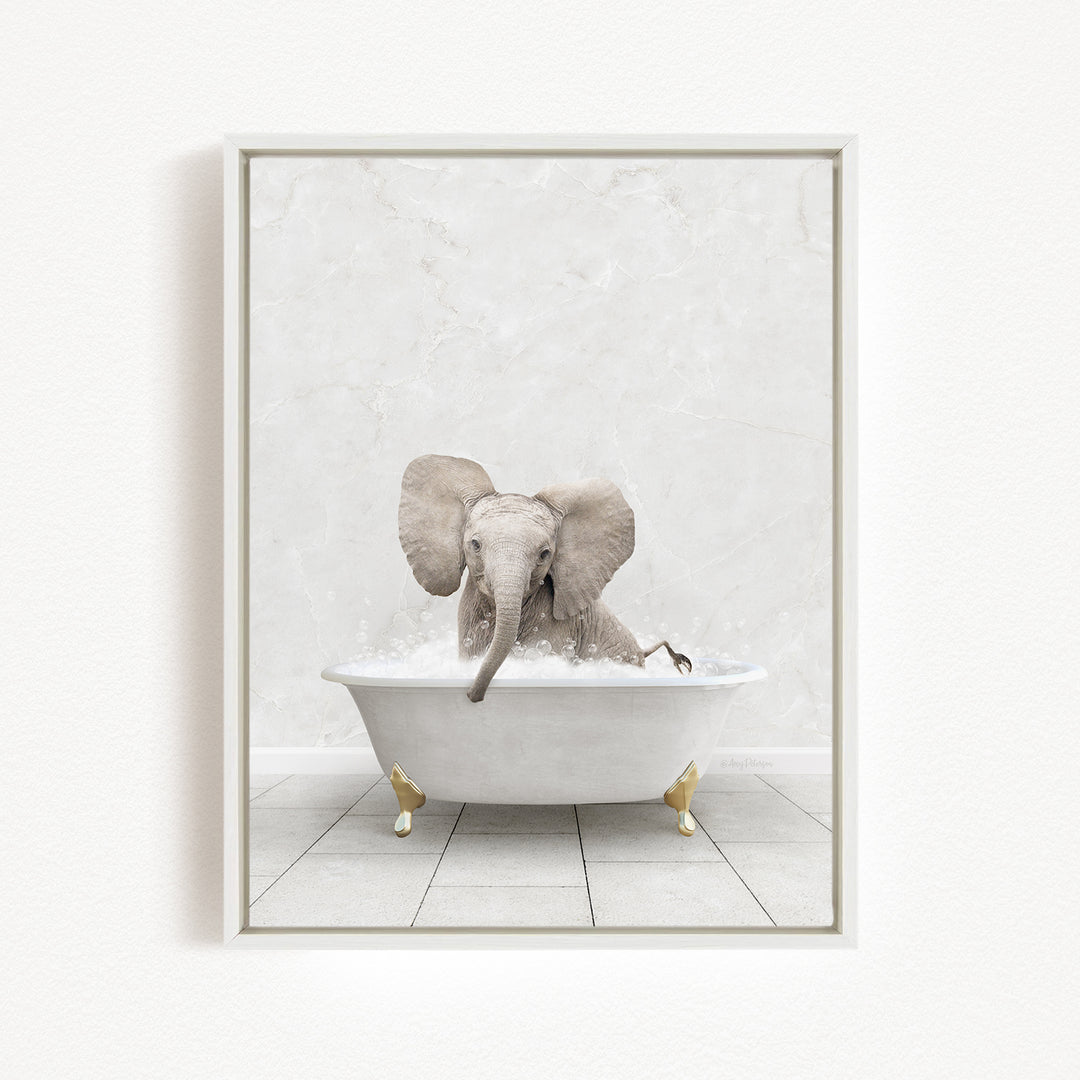 A baby elephant sitting in a white bathtub filled with water, surrounded by a white marble-like background.