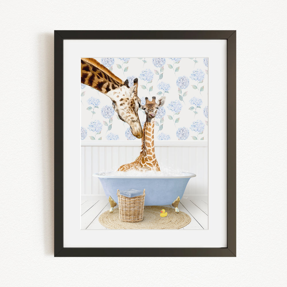 A giraffe and a baby giraffe are sitting in a blue bathtub filled with water, surrounded by a floral patterned wall and a basket of rubber ducks.