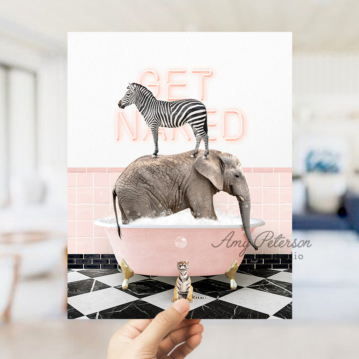 a person holding up a card with a picture of an elephant and a zebra on