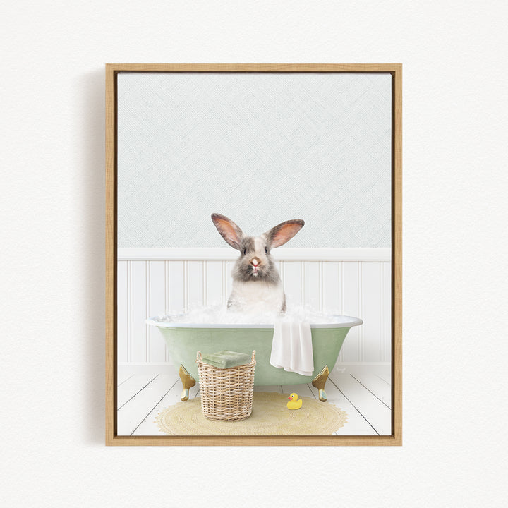 A rabbit sitting in a green bathtub filled with water, surrounded by rubber ducks and a basket.