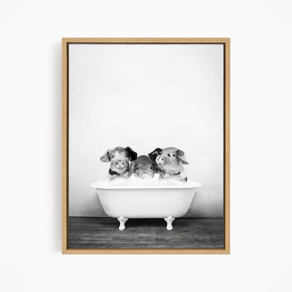 Three adorable pigs sitting in a white bathtub, enjoying a relaxing bath together.