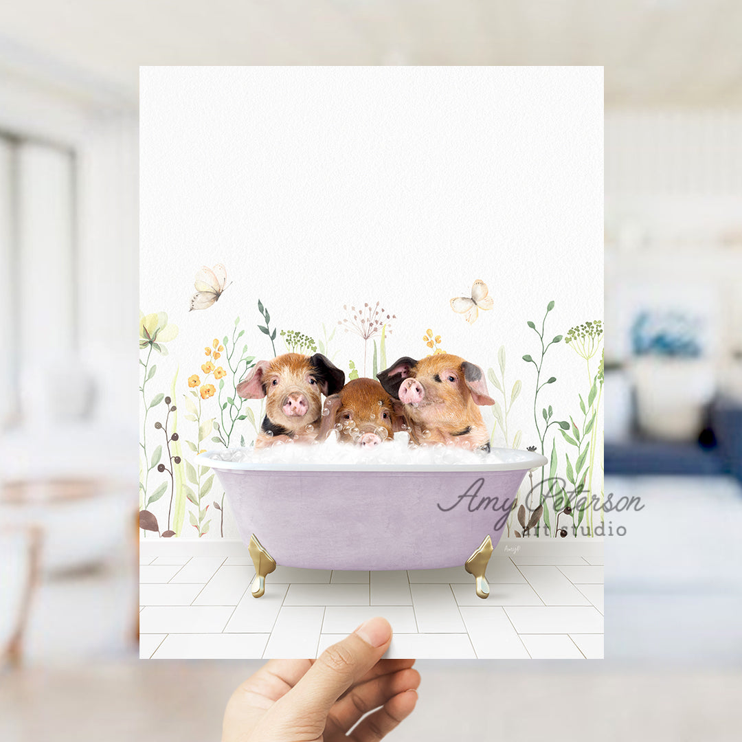 a hand holding up a card with three little pigs in a bathtub