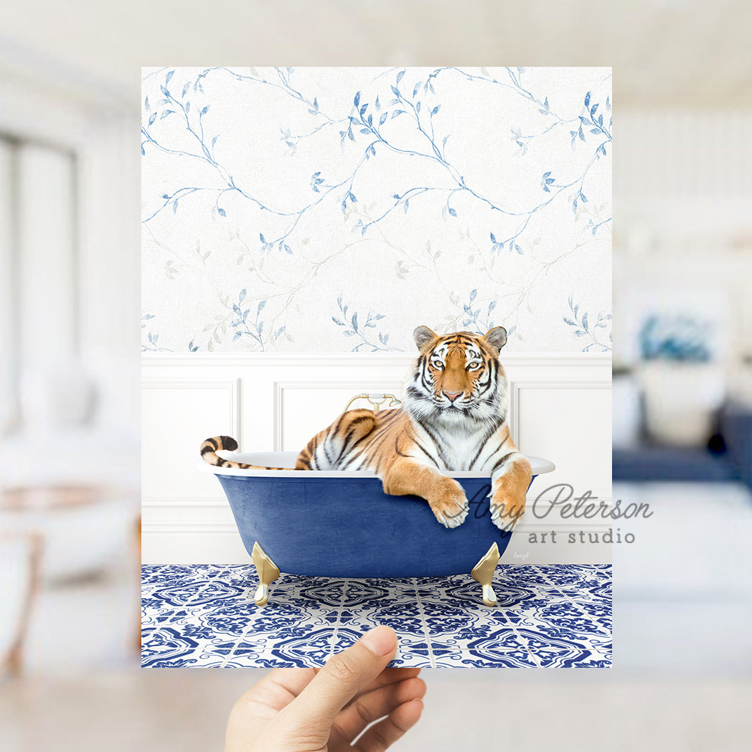 a hand holding a card with a picture of a tiger in a bathtub