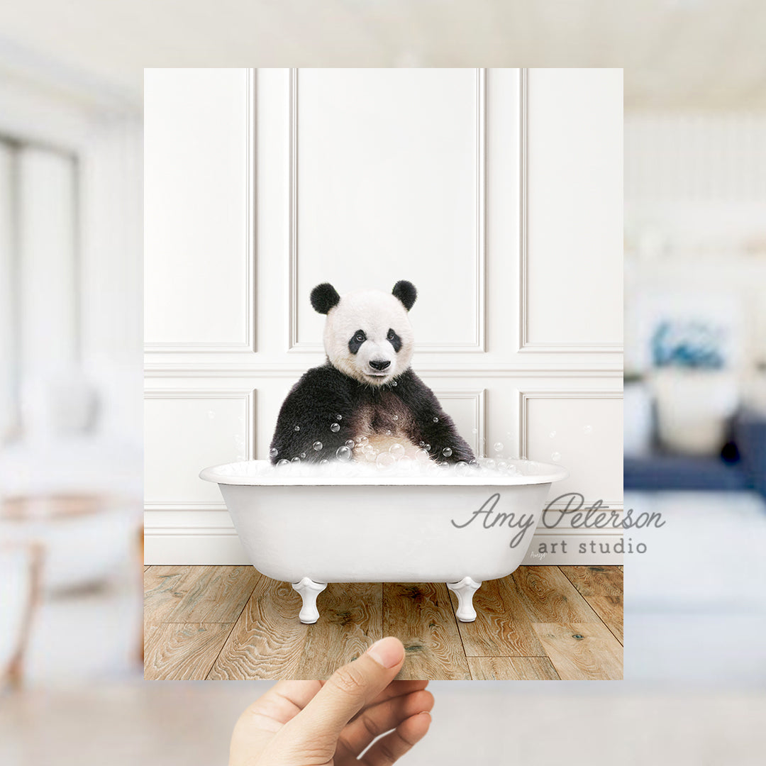 a panda bear sitting in a bath tub