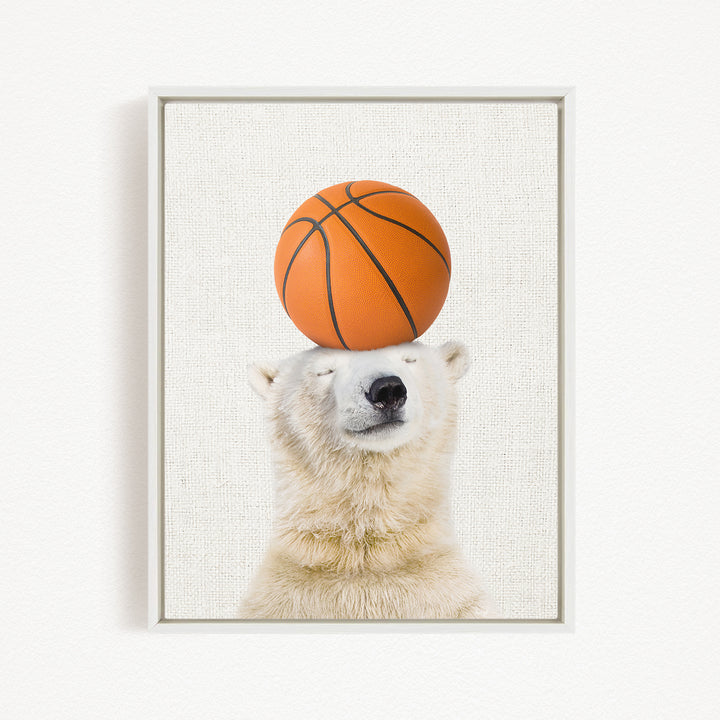 A polar bear balancing a basketball on its head.