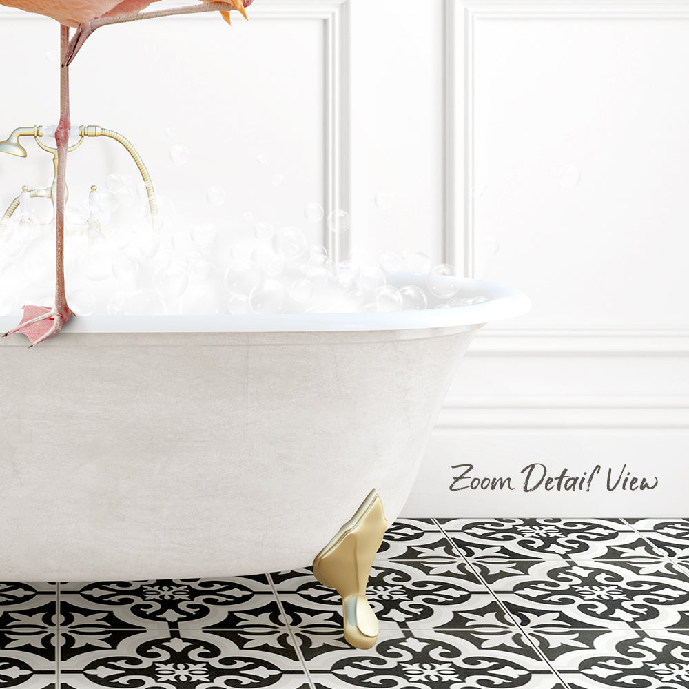 A white claw-foot bathtub filled with bubbles, with a pink flamingo perched on the edge.