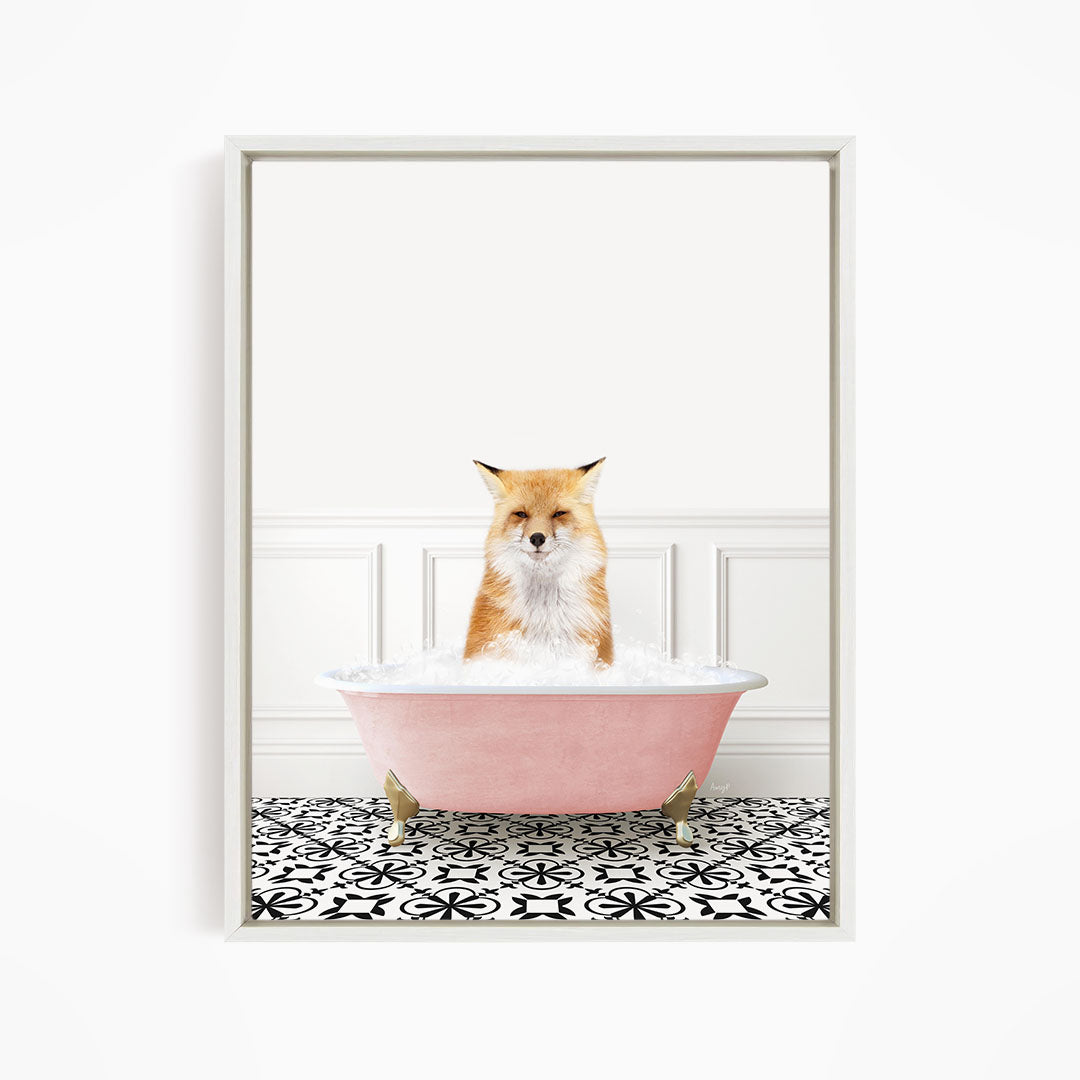 A fox is sitting in a pink bathtub filled with bubbles, looking directly at the camera.
