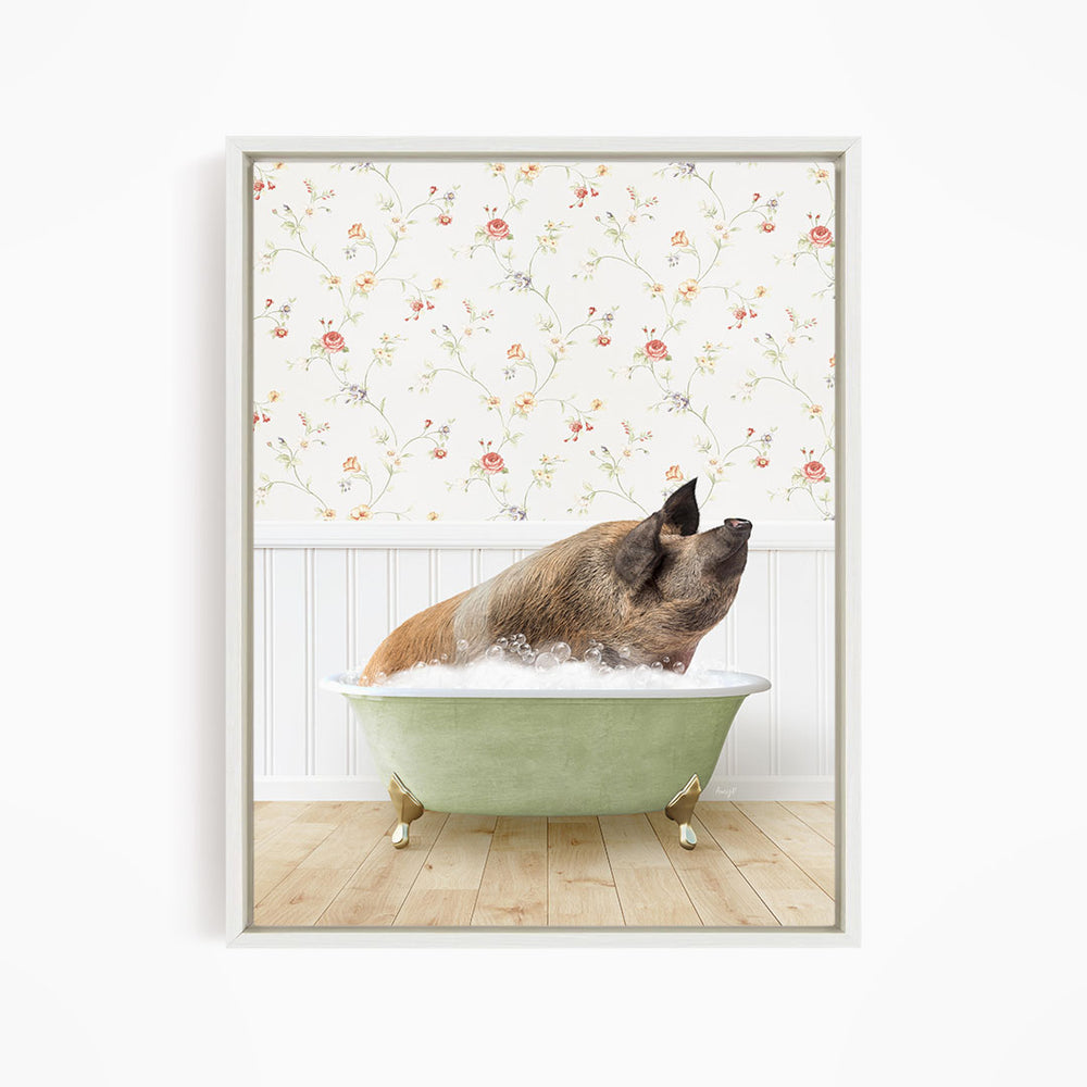 A brown pig sitting in a green bathtub filled with water, with a floral wallpaper in the background.