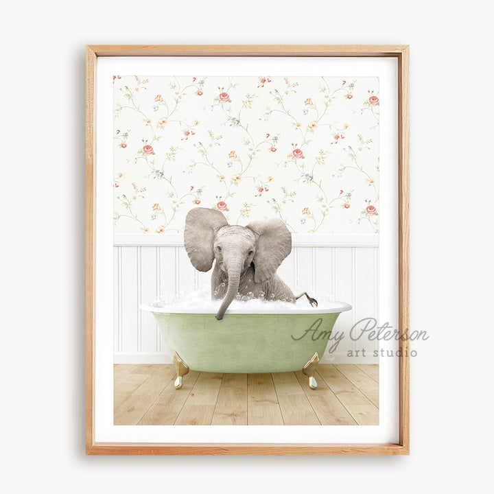 an elephant taking a bath in a green bathtub